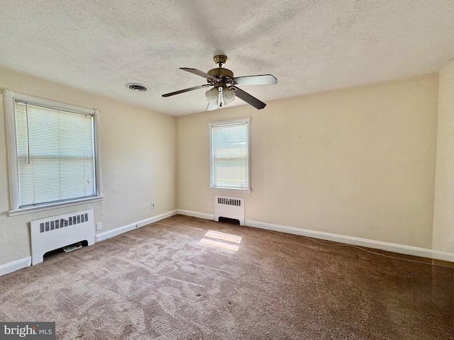 3913 Loch Raven Blvd, Baltimore, MD 21218 - spare room featuring radiator, a textured ceiling, a ceiling fan, and carpet floors