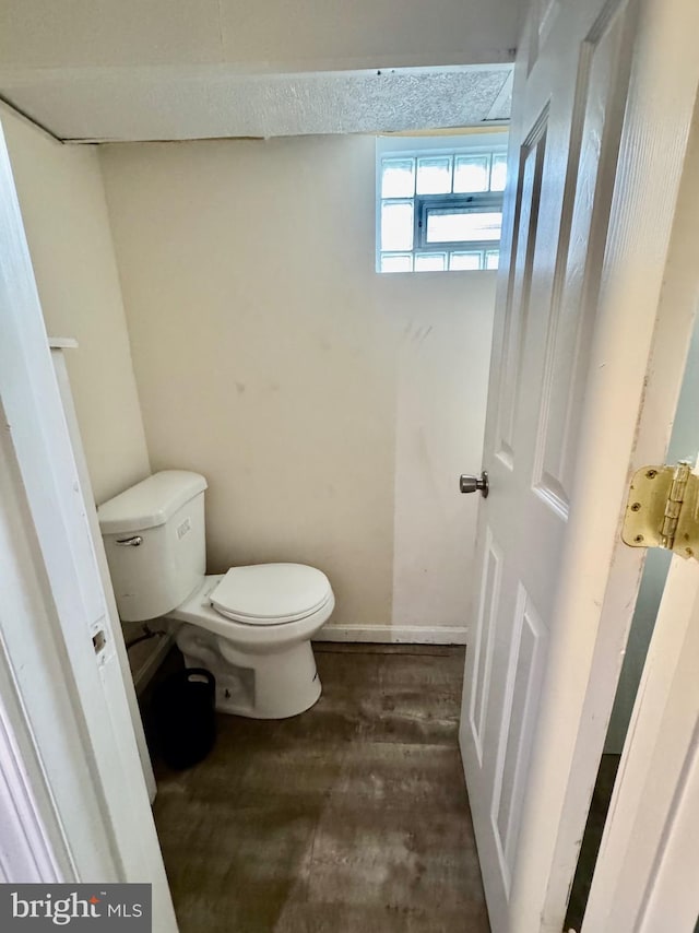 3913 Loch Raven Blvd, Baltimore, MD 21218 - bathroom featuring toilet and wood finished floors