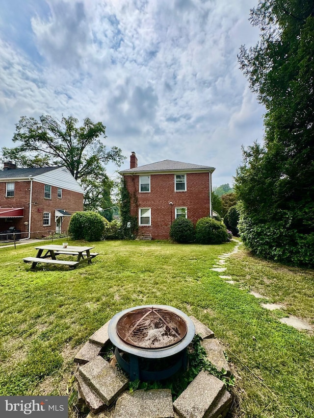3913 Loch Raven Blvd, Baltimore, MD 21218 - view of grassy yard featuring a fire pit