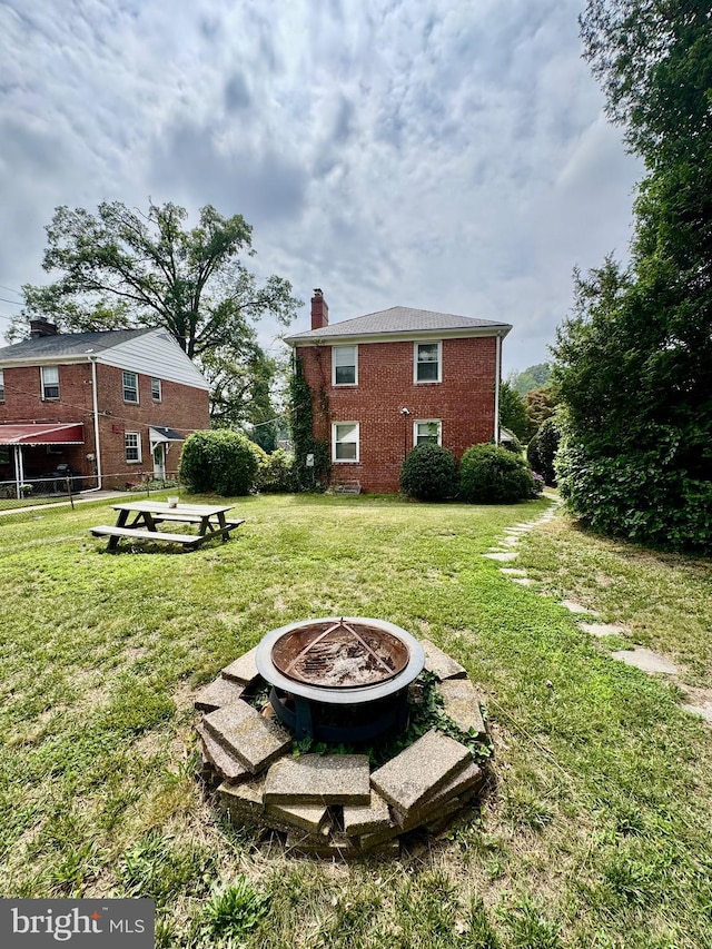 3913 Loch Raven Blvd, Baltimore, MD 21218 - view of grassy yard featuring an outdoor fire pit