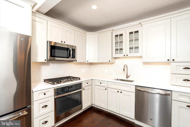 5 Madison St, Princeton, NJ 08542 - kitchen with stainless steel appliances, light countertops, glass insert cabinets, and tasteful backsplash