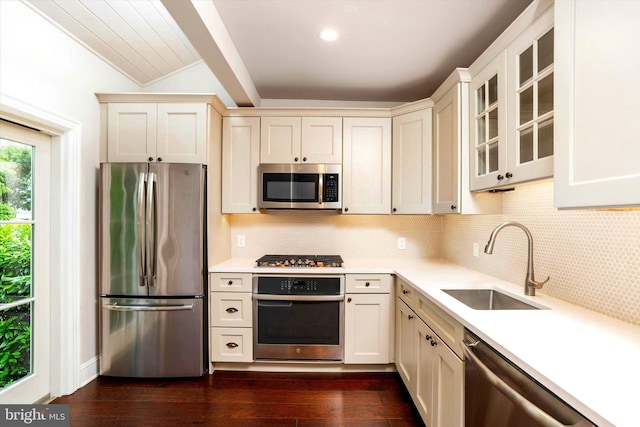 5 Madison St, Princeton, NJ 08542 - kitchen featuring stainless steel appliances, light countertops, glass insert cabinets, dark wood-style flooring, and beam ceiling