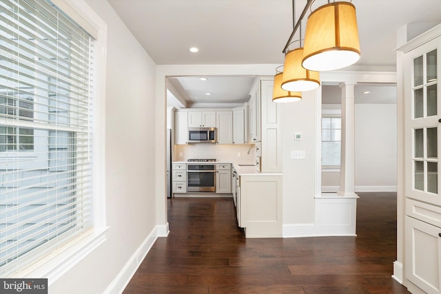5 Madison St, Princeton, NJ 08542 - kitchen featuring appliances with stainless steel finishes, plenty of natural light, dark wood-style flooring, light countertops, and recessed lighting