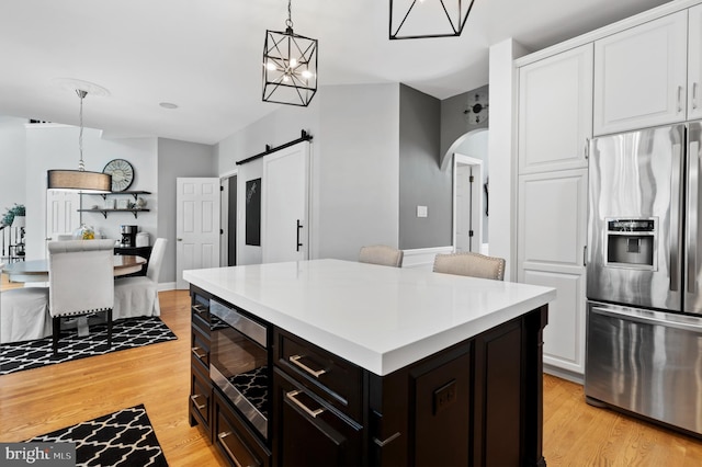 75 Bittersweet Dr, Doylestown, PA 18901 - kitchen featuring appliances with stainless steel finishes, white cabinetry, light wood finished floors, and light countertops
