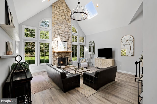 75 Bittersweet Dr, Doylestown, PA 18901 - living area featuring high vaulted ceiling, plenty of natural light, a fireplace, and wood finished floors