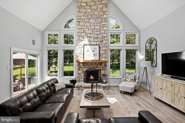 75 Bittersweet Dr, Doylestown, PA 18901 - living room with high vaulted ceiling, a fireplace, and wood finished floors