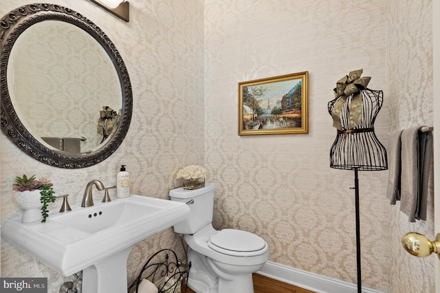 75 Bittersweet Dr, Doylestown, PA 18901 - half bathroom featuring wallpapered walls and wood finished floors