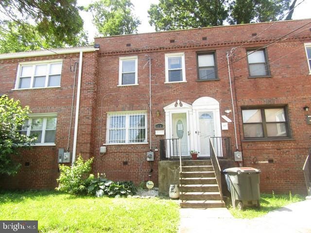 5045 Sheriff Rd NE, Washington, DC 20019 - townhome / multi-family property with brick siding