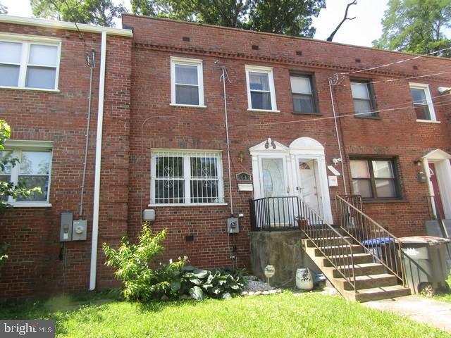 5045 Sheriff Rd NE, Washington, DC 20019 - townhome / multi-family property with brick siding