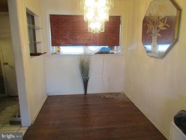 5045 Sheriff Rd NE, Washington, DC 20019 - unfurnished dining area with wood finished floors, a chandelier, and built in features