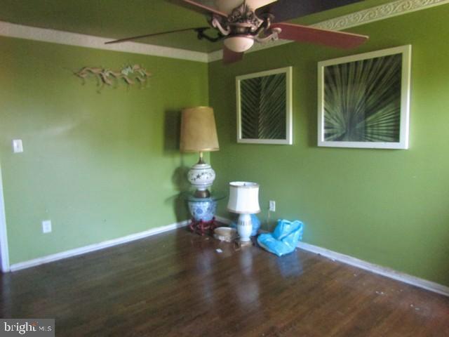 5045 Sheriff Rd NE, Washington, DC 20019 - empty room with ceiling fan and wood finished floors
