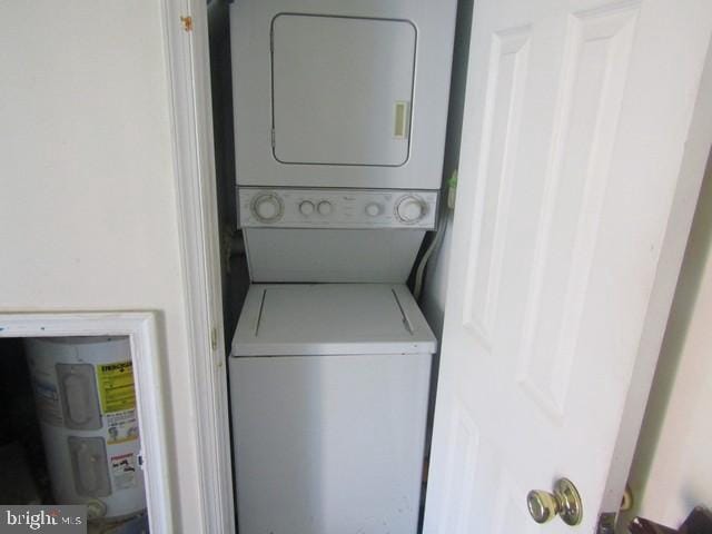 5045 Sheriff Rd NE, Washington, DC 20019 - laundry area featuring estacked washer and dryer and water heater