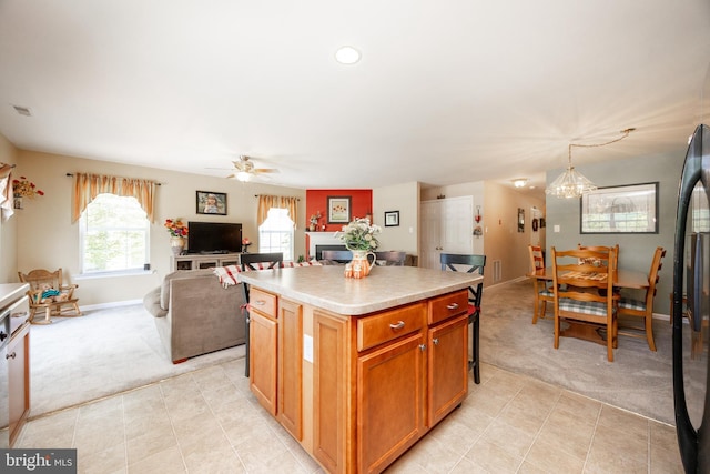 2751 Fynamore Ln, Downingtown, PA 19335 - kitchen with light carpet, a ceiling fan, a center island, light countertops, and recessed lighting