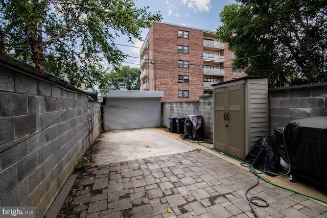 1427 K St SE, Washington, DC 20003 - fenced backyard with a storage unit, area for grilling, and a patio area