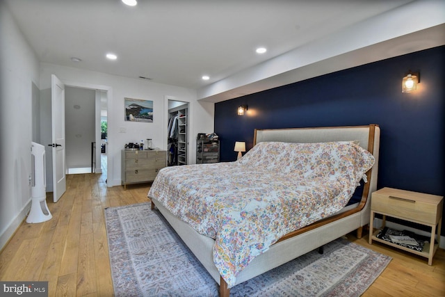 1427 K St SE, Washington, DC 20003 - bedroom featuring wood finished floors, a spacious closet, recessed lighting, and a closet