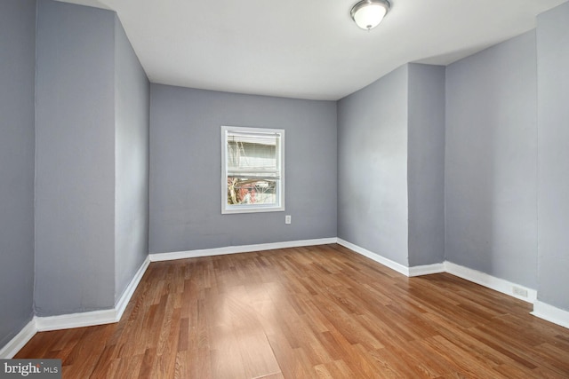 736 Bartlett Ave, Baltimore, MD 21218 - spare room featuring wood finished floors and baseboards
