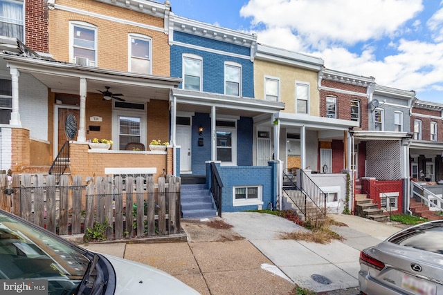 736 Bartlett Ave, Baltimore, MD 21218 - view of property with a porch, brick siding, stairway, and ceiling fan