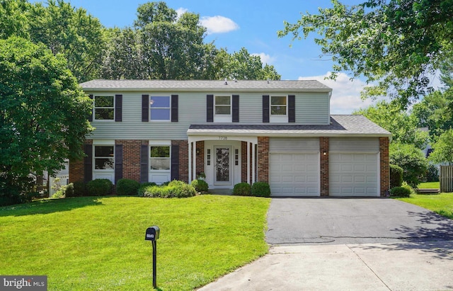 7728 Barnstable Pl, Rockville, MD 20855 - view of front facade with brick siding, a front lawn, and asphalt driveway