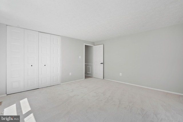 7728 Barnstable Pl, Rockville, MD 20855 - unfurnished bedroom with carpet, a textured ceiling, and a closet