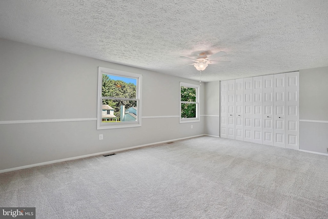 7728 Barnstable Pl, Rockville, MD 20855 - unfurnished bedroom with carpet flooring, a textured ceiling, and ceiling fan