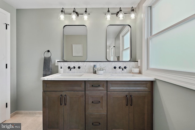 7728 Barnstable Pl, Rockville, MD 20855 - bathroom featuring plenty of natural light, double vanity, and decorative backsplash