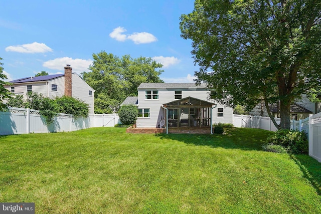 7728 Barnstable Pl, Rockville, MD 20855 - rear view of property with a sunroom and a fenced backyard