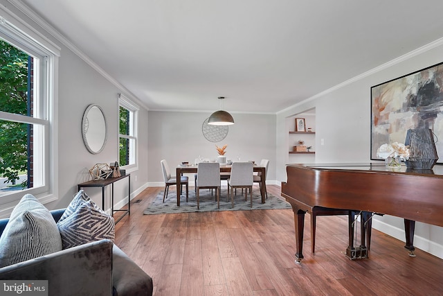 7728 Barnstable Pl, Rockville, MD 20855 - dining area featuring plenty of natural light, ornamental molding, and wood finished floors