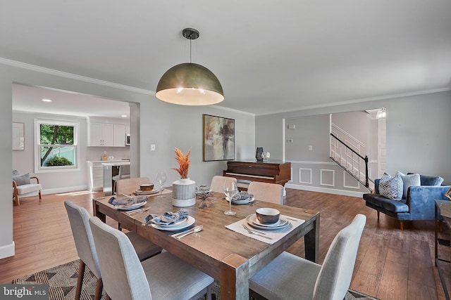 7728 Barnstable Pl, Rockville, MD 20855 - dining space featuring stairway, hardwood / wood-style flooring, and ornamental molding