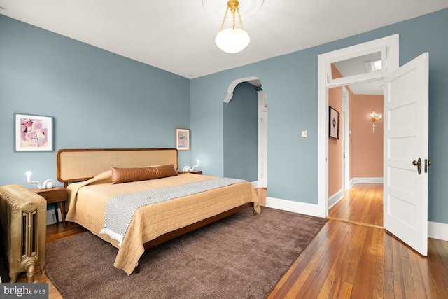 61 W St NW, Washington, DC 20001 - bedroom featuring arched walkways and hardwood / wood-style flooring