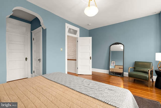 61 W St NW, Washington, DC 20001 - bedroom featuring wood finished floors and arched walkways