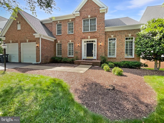 12054 Greatbridge Rd, Woodbridge, VA 22192 - view of front of home featuring brick siding, roof with shingles, and concrete driveway