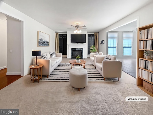 12054 Greatbridge Rd, Woodbridge, VA 22192 - living room featuring a ceiling fan and a fireplace