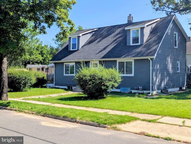 700 S Belleview Ave, Cinnaminson, NJ 08077 - view of front of home featuring a front lawn, a chimney, and roof with shingles
