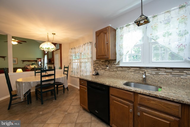 9 Stirrup Way, Burlington, NJ 08016 - kitchen featuring black dishwasher, tasteful backsplash, light stone countertops, light tile patterned flooring, and hanging light fixtures