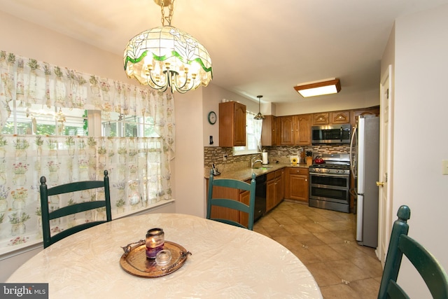 9 Stirrup Way, Burlington, NJ 08016 - dining space featuring a chandelier and light tile patterned floors