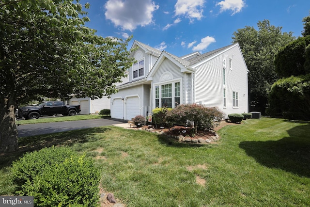 9 Stirrup Way, Burlington, NJ 08016 - view of front of home featuring asphalt driveway, a garage, and a front yard