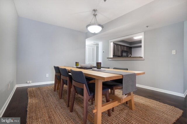 10248 Appalachian Cir Unit 1-D7, Oakton, VA 22124 - dining space featuring dark wood finished floors and baseboards