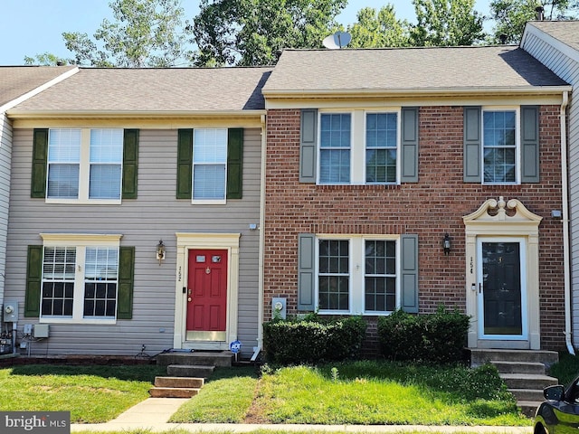 152 Foxview Dr, Glen Burnie, MD 21061 - multi unit property with entry steps, brick siding, and a front yard