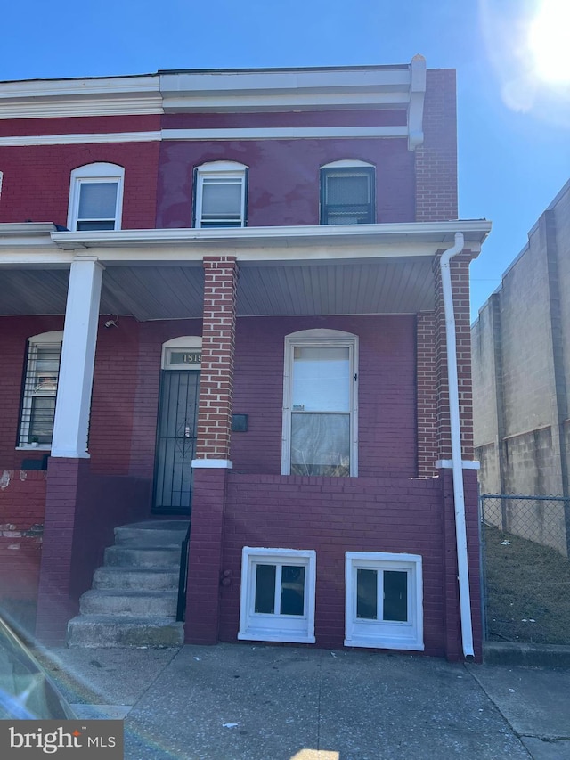 1819 Presstman St, Baltimore, MD 21217 - townhome / multi-family property featuring brick siding and covered porch