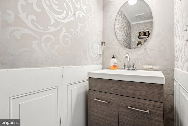 116 Lake Arrowhead Cir, Bear, DE 19701 - bathroom with wallpapered walls, vanity, and ornamental molding