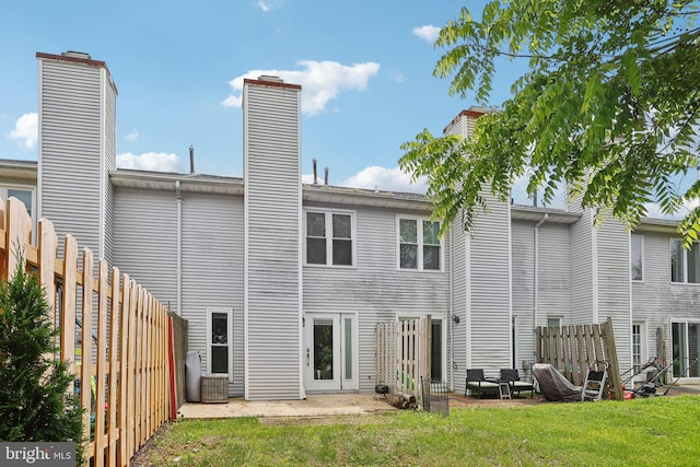116 Lake Arrowhead Cir, Bear, DE 19701 - back of house featuring a chimney and a patio area