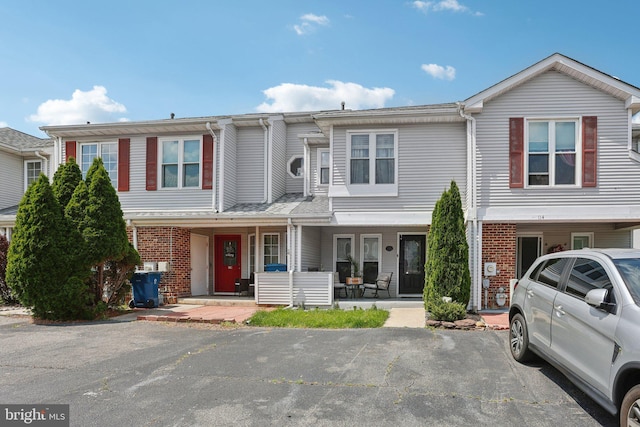 116 Lake Arrowhead Cir, Bear, DE 19701 - townhome / multi-family property with brick siding and a porch