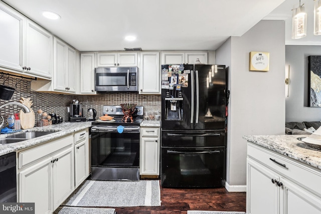 116 Lake Arrowhead Cir, Bear, DE 19701 - kitchen with black appliances, dark wood-style flooring, decorative backsplash, white cabinetry, and light stone countertops