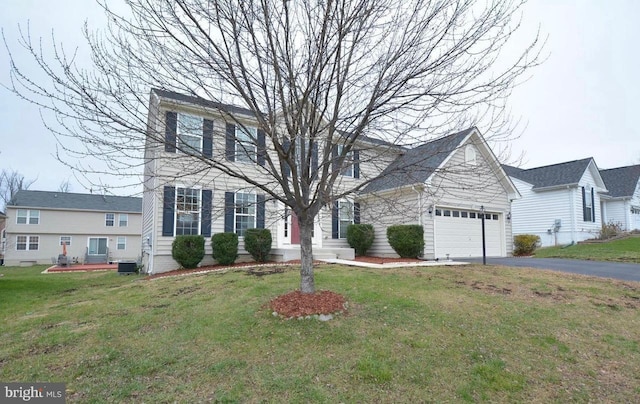 16393 Topsail Ln, Woodbridge, VA 22191 - view of front of house featuring a garage, driveway, and a front yard