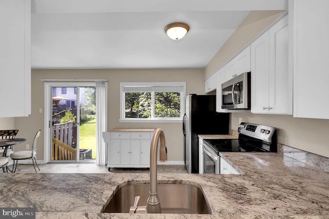8916 Rosewood Way, Jessup, MD 20794 - kitchen featuring appliances with stainless steel finishes, white cabinets, and light stone counters