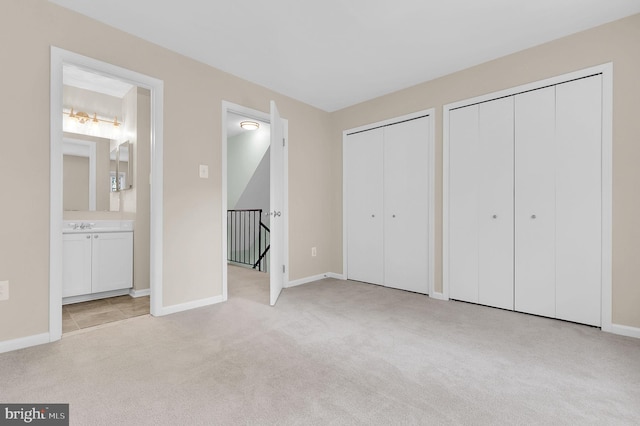 8916 Rosewood Way, Jessup, MD 20794 - unfurnished bedroom with multiple closets, carpet flooring, and ensuite bathroom