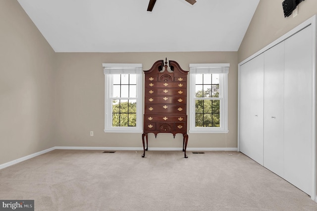 8916 Rosewood Way, Jessup, MD 20794 - unfurnished bedroom featuring multiple windows, light colored carpet, a closet, lofted ceiling, and ceiling fan