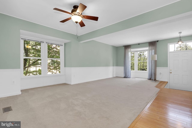 8916 Rosewood Way, Jessup, MD 20794 - entrance foyer with a wainscoted wall, a ceiling fan, and wood finished floors
