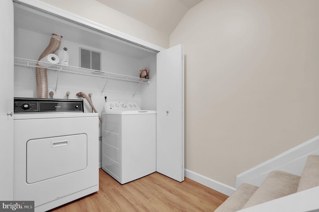 8916 Rosewood Way, Jessup, MD 20794 - washroom with washing machine and clothes dryer and light wood-type flooring