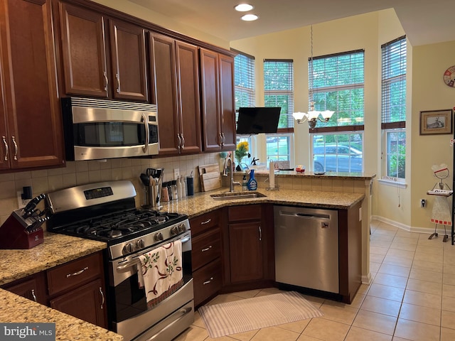 86 Ables Run Dr, Absecon, NJ 08201 - kitchen with appliances with stainless steel finishes, light tile patterned floors, a peninsula, decorative backsplash, and recessed lighting